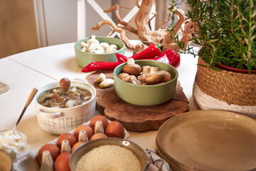 top view of the table with ingredients for cooking potatoes with mushrooms