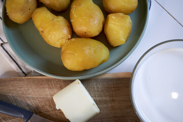 top view of boiled potatoes in a green ceramic plate
