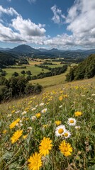 Obraz premium Vibrant floral landscape with yellow daisies and white flowers against a scenic mountainous background