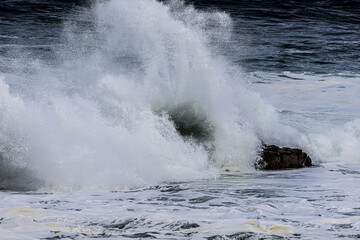 waves crashing on rocks