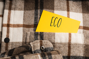 Yellow card with a handwritten inscription 