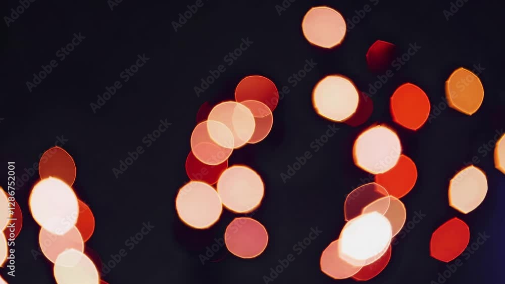 Poster abstract video of colorful bokeh lights, captured from a low angle. the soft, circular patterns crea