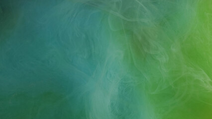 Marble surface. Colorful fog. Blue green mix ink in storm blur swirling flow. Airy curling smoke paint with mystical smoothing water abstract background.