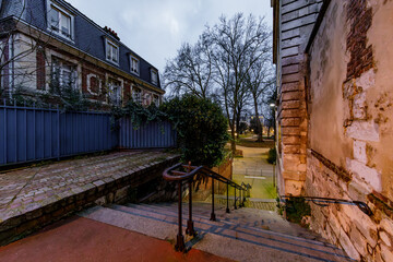ROUEN, NORMANDY, FRANCE - 2025: Faucon street, small pedestrian street with big stairs, next to Museum of Antiquities