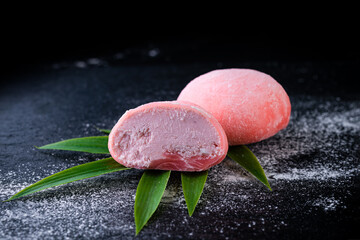strawberry dessert daifuku mochi on a dark background