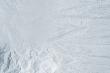 Crumpled white paper background.