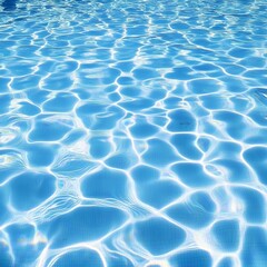 Sunlight ripples across clear, cool swimming pool water. Refreshing and serene.