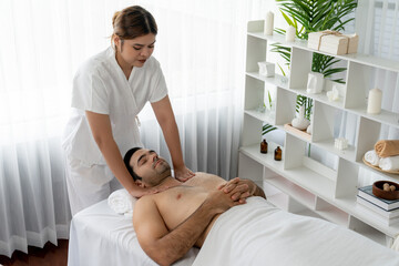 Caucasian man customer enjoying relaxing anti-stress spa massage and pampering with beauty skin...