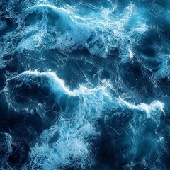 Fototapeta premium Aerial view of ocean waves creating dynamic textures and rhythmic patterns.