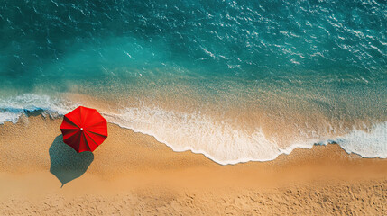 Aerial View of Beach with Red Umbrella and Ocean Waves