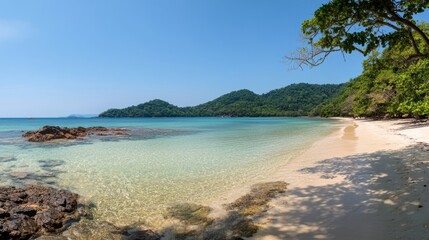 Obraz premium Tropical beach with clear blue water and white sand, embodying serene simplicity. 