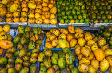 Tropical fruits background. Fresh fruits in outdoor market in Sri Lanka, Asia