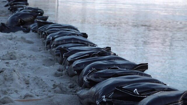 Sandbags protect city center of Deventer during high water levels in the Netherlands, flood risk and climate change Europe
