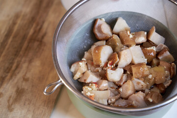 top view of sliced mushrooms in a colander