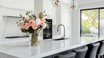 A modern kitchen blooms with pastel flowers atop a luxurious marble countertop, harmonizing elegance with contemporary design.