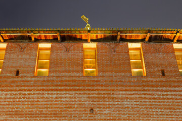 Fototapeta premium A brick building with a gold statue on top. Sights of the Nizhny Novgorod Kremlin