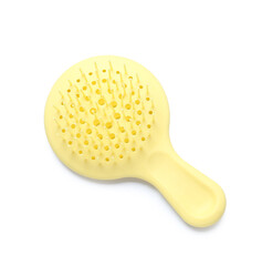 Yellow hair brush on white background