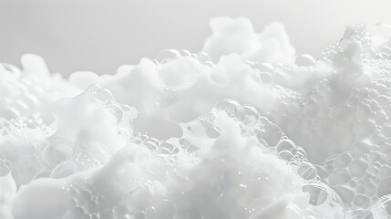 Fototapeta premium Close up of white soap foam texture on plain background with abstract patterns and bubbles