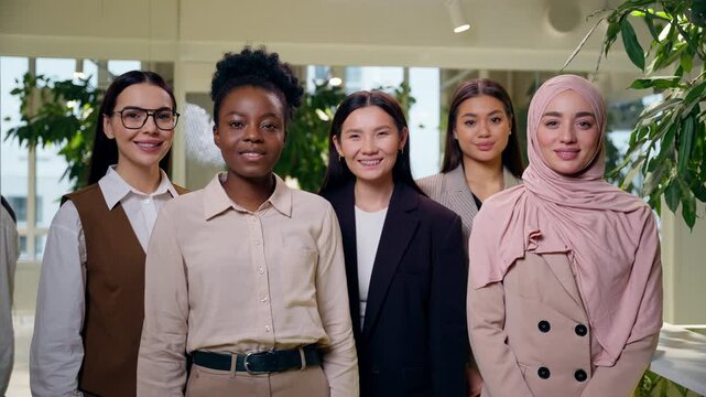 Portrait happy smiling successful multiethnic women females diversity team girls coworkers businesswomen business colleagues looking at camera smile together career equality feminism in office company