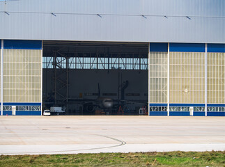 Aircraft hangar with partially open doors