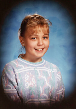 Circa 1989 - Vintage school portrait of a 5th grader girl, roughly 10 years old. Vintage image is a scanned photograph and may have defects