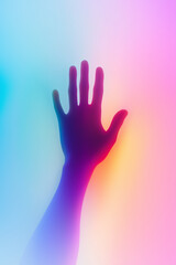 Obraz premium Hand reaching out on vibrant rainbow gradient background