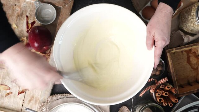 Baking apple pie cupcakes with buttercream frosting. Baking cupcakes in the kitchen with apples and homemade icing. Apple pie cupcakes instructional video.