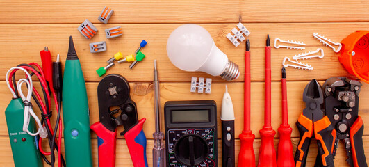 Electrical Tools and Components on Wooden Background