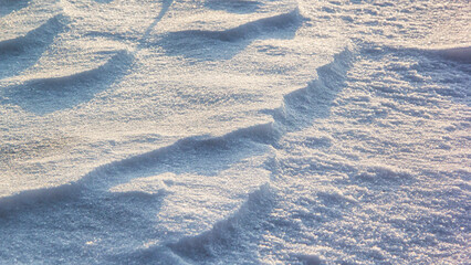 Abstract volumetric pattern on snow on ice in winter