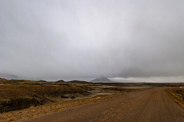 Otherworldly landscape of majestic Factory Butte on a cold and rainy day in the Utah desert.