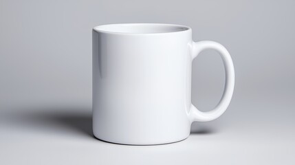 Fototapeta premium Clean White Mug Mockup Isolated on Neutral Background for Branding and Design