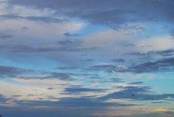 Fototapeta premium blue sky in the afternoon with white clouds and black clouds are a sign that night is coming