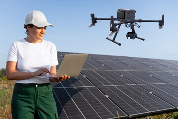 Woman controls the industrial drone for inspecting solar panels