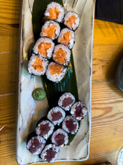 Delicious hosomaki resting on a banana leaf with wasabi, ready to be eaten