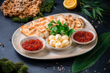appetizer red caviar, butter and toast