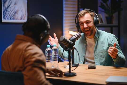 Man recording podcast using high tech microphones to interview guest, ensuring flawless video and sound quality for audience