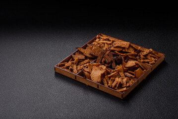 Crispy homemade brown bread chips with seeds and grains
