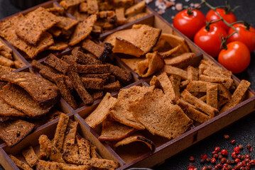 Crispy homemade brown bread chips with seeds and grains