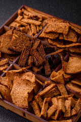 Crispy homemade brown bread chips with seeds and grains