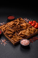 Crispy homemade brown bread chips with seeds and grains