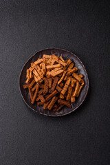 Crispy homemade brown bread crackers or croutons with seeds and grains