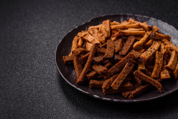 Crispy homemade brown bread crackers or croutons with seeds and grains