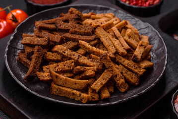 Crispy homemade brown bread crackers or croutons with seeds and grains