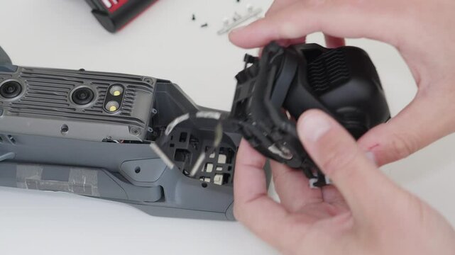 Detailed drone repair process focusing on interior component maintenance and troubleshooting techniques