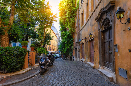 Fototapeta View of old narrow street in Rome, Italy. Architecture and landmark of Rome. Cozy cityscape of Rome.