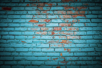 Brick wall with peeling paint and vignette