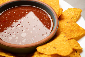 nachos and salsa dip close up