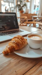 Cafe Workspace Serenity: An inviting still life captures a moment of focus at a cafe, featuring a laptop, a steaming cup of coffee with latte art, and a fresh croissant.