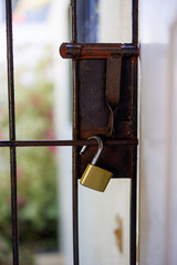 Old rusty metal door with lock
