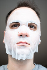 man with facial mask on face